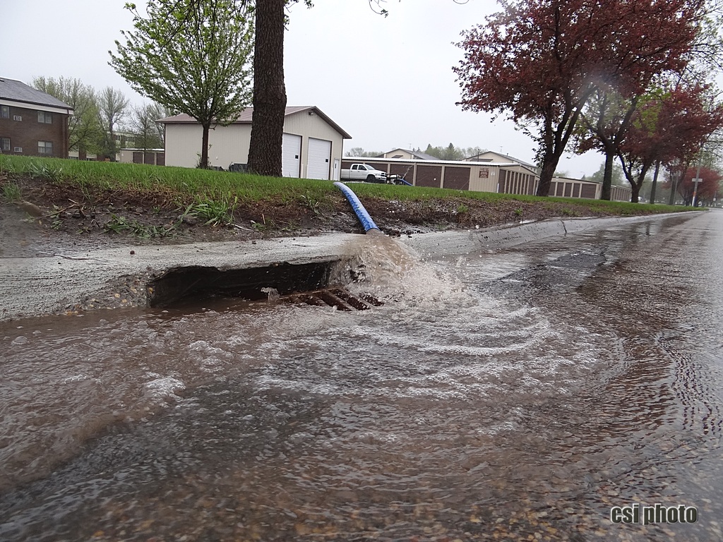 Pumping water off parking lot southside of 13th St NE - CSi photo